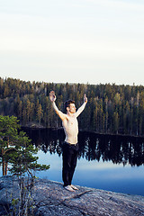 Image showing middle age man doing sport yoga on the top of the mountain, lifestyle people outdoor, summer wild nature for training