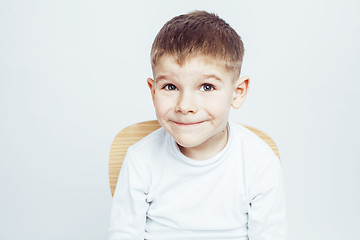 Image showing little cute adorable boy posing gesturing cheerful on white background, lifestyle people concept closeup