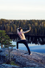 Image showing middle age man doing sport yoga on the top of the mountain, lifestyle people outdoor, summer wild nature for training