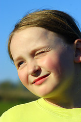 Image showing little girl squinting