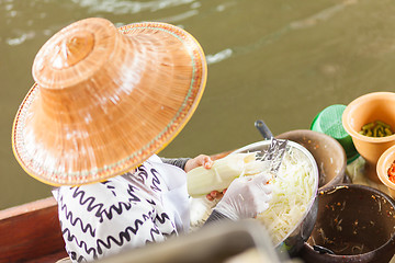 Image showing Thai woman preparing food