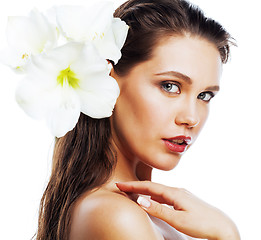 Image showing young pretty woman with  Amarilis flower close up isolated on wh