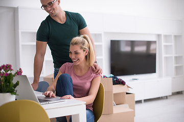 Image showing Young couple moving in a new home