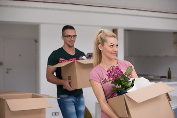 Image showing young couple moving into a new home