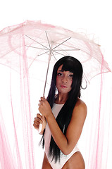 Image showing Closeup of woman in bathing suit and umbrella.