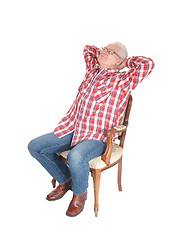 Image showing Senior man relaxing on chair.