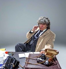 Image showing The senior man as detective or boss of mafia on gray studio background