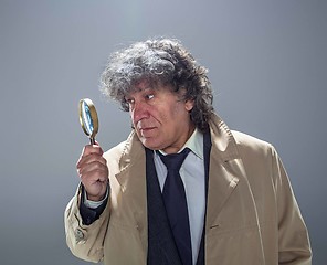 Image showing The senior man as detective or boss of mafia on gray studio background