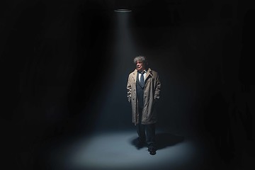 Image showing The senior man as detective or boss of mafia on gray studio background