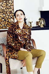 Image showing pretty stylish woman in fashion dress with leopard print together in luxury rich room interior, lifestyle people concept, modern brunette together