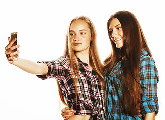 Image showing cute teenage girls making selfie isolated