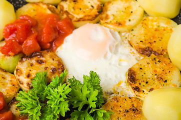 Image showing Scrambled eggs with zucchini and vegetables, close-up