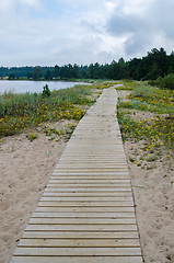 Image showing Wooden path along the sandy shore of the Baltic Sea