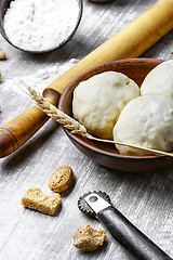 Image showing dough with flour and rolling pin