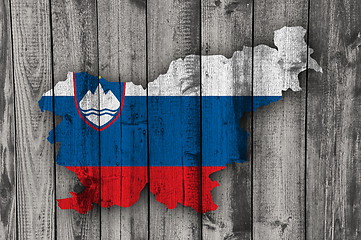 Image showing Map and flag of Slovenia on weathered wood