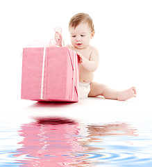 Image showing baby boy in diaper with big gift box