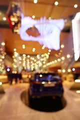 Image showing Blurred, defocused background of public event exhibition hall showing cars and automobiles