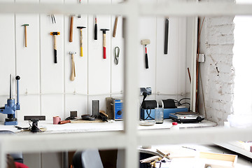 Image showing Craft workshop , tools hanging on the wall