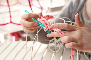 Image showing Needlework. Handicraft. Knitting crochet. The woman knits crochet.