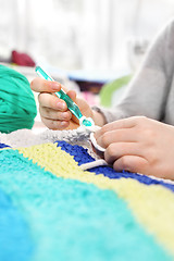 Image showing Knitting crochet. The woman knits crochet.