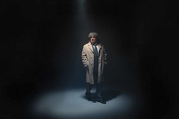 Image showing The senior man as detective or boss of mafia on gray studio background