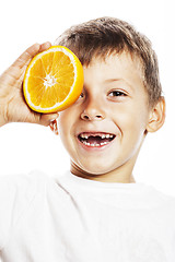 Image showing little cute boy with orange fruit double isolated on white smili