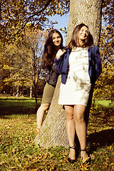 Image showing mature real mother with daughter outside autumn fall in park