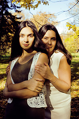 Image showing mature real mother with daughter outside autumn fall in park