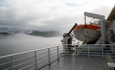 Image showing Orange Lifeboat Inside Passage Sea Ocean Liner Cruise