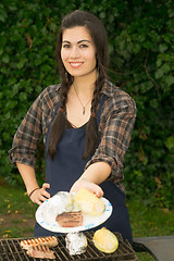 Image showing Pretty Woman Smiling Cooking Steaks Barbecue Backyard Food Grill