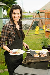 Image showing Pretty Woman Smiling Cooking Steaks Barbecue Backyard Food Grill