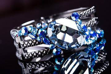 Image showing Bracelet with blue stones over black