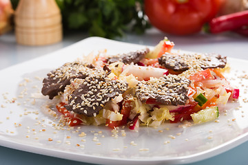 Image showing salad with meat. grilled beef tongue