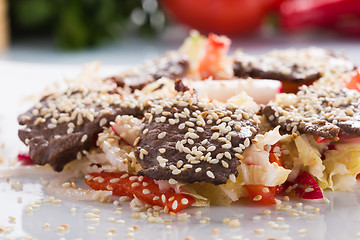 Image showing salad with meat. grilled beef tongue