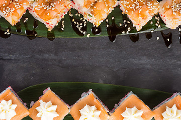 Image showing set of sushi on a slate square plate. space for copy