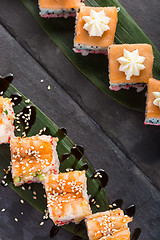 Image showing set of sushi on a slate square plate. space for copy