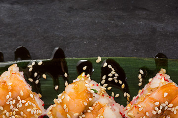 Image showing set of sushi on a slate square plate. space for copy