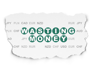 Image showing Currency concept: Wasting Money on Torn Paper background