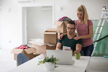 Image showing Young couple moving in a new home