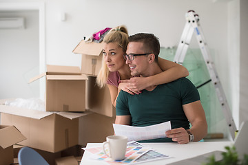 Image showing Young couple moving in a new home