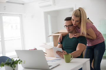 Image showing Young couple moving in a new home