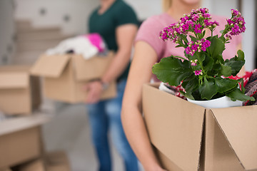 Image showing young couple moving into a new home