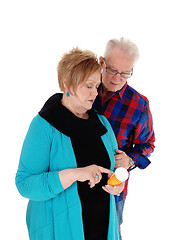 Image showing Wife showing husband his pills.