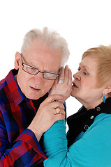 Image showing Wife whisper in husband ear.