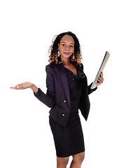 Image showing Serious woman showing her paper.