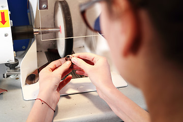 Image showing Polishing jewelry. Studio jewelery, manual creation of jewelry