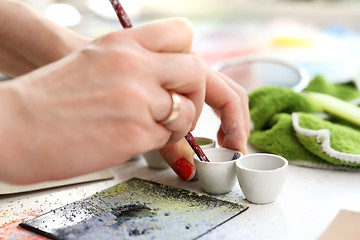 Image showing Painting tiles. Hand decorated ceramic tiles.