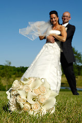 Image showing Bouquet and wedding couple