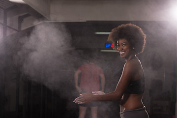 Image showing black woman preparing for climbing workout