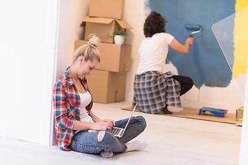 Image showing Happy couple doing home renovations